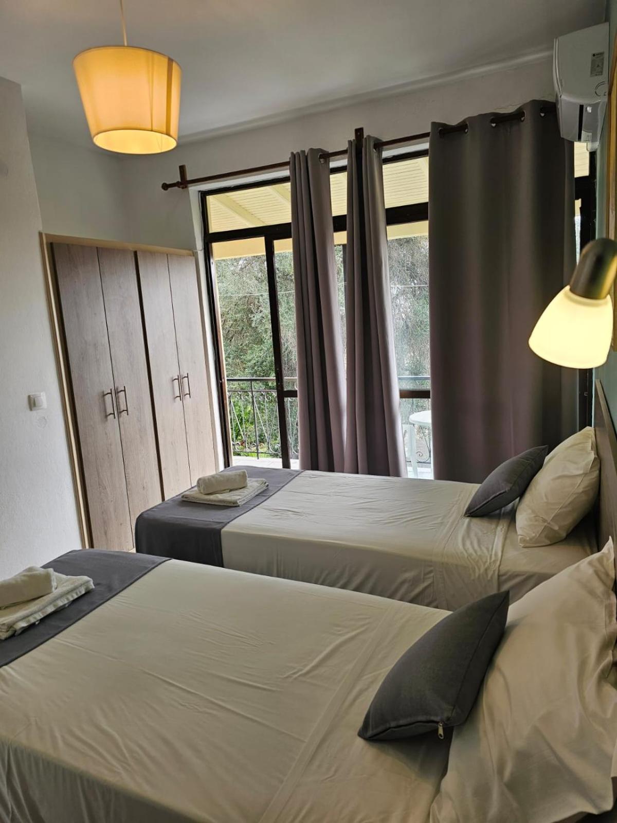Апартаменты Gardelis Gardens Бенитсес Номер фото