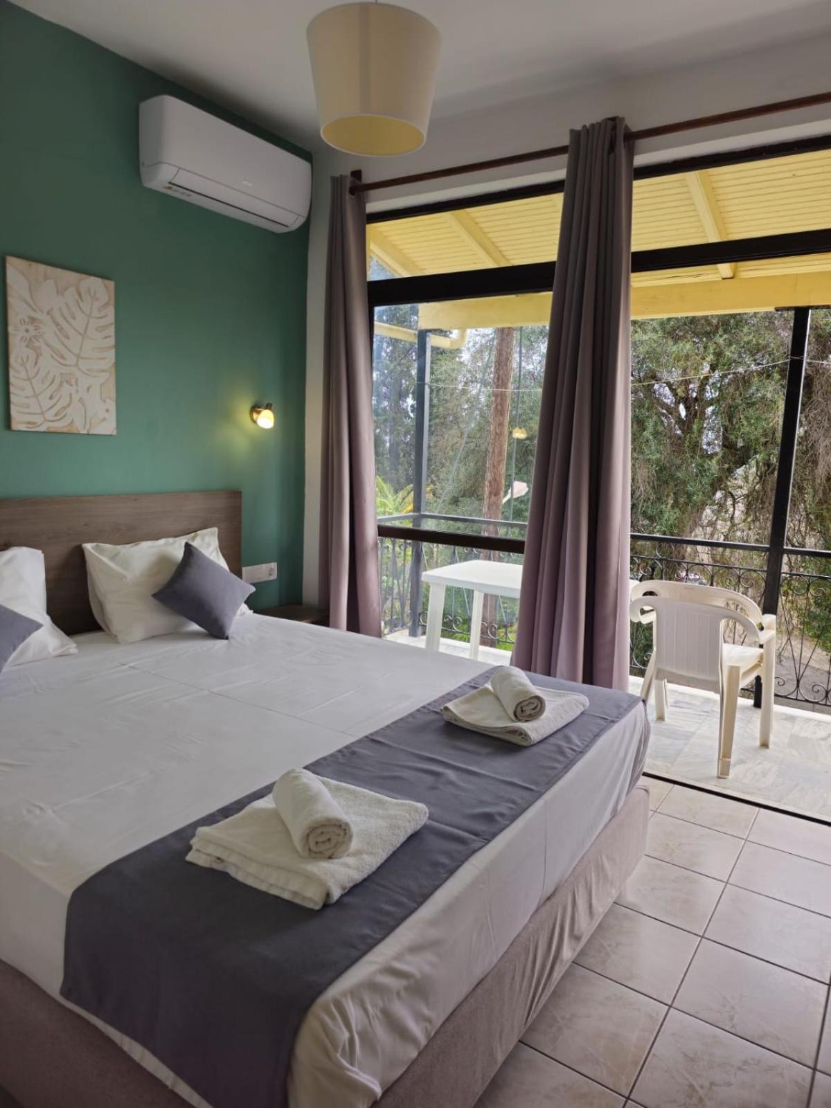 Апартаменты Gardelis Gardens Бенитсес Номер фото